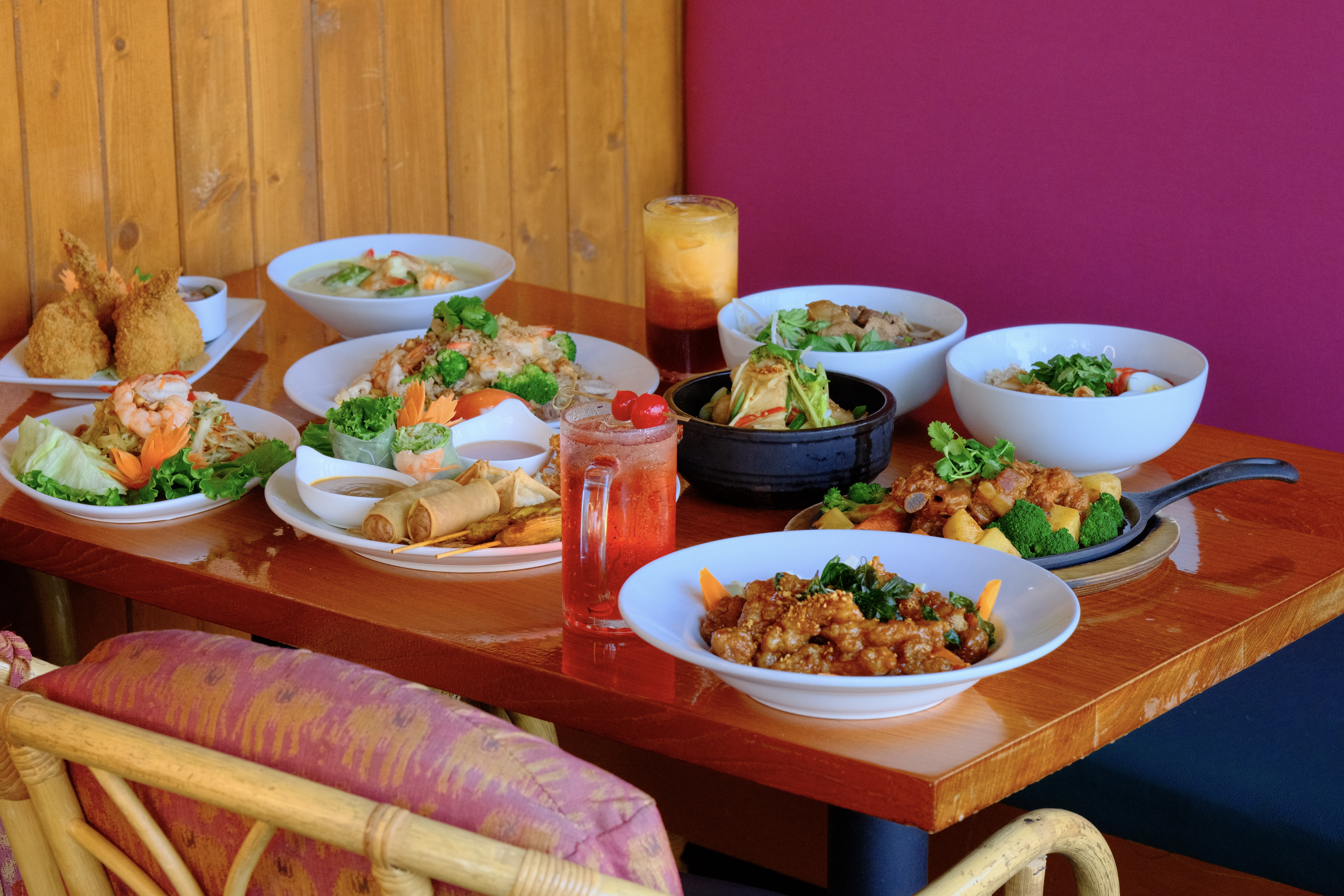 Authentic Thai feast featuring various dishes at Racha Thai Cuisine, Woodinville